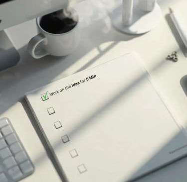 Notebook with one task checked off, showing small steps to beat procrastination.