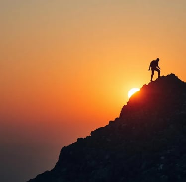Silhouette of a person climbing a mountain at sunrise, symbolizing growth mindset and progress.