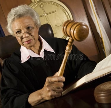 Family court judge strikes the gavel before making a decision in a child support case.