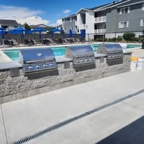 CMU barbeque pedestal with gas grills installed