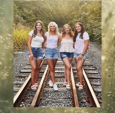 picture of the author and her 3 daughters at rail road tracks, family photo