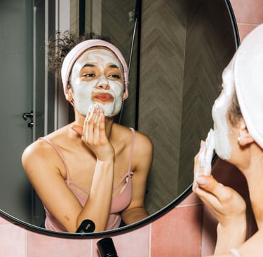 a woman with a towel on her face and a towel on her head