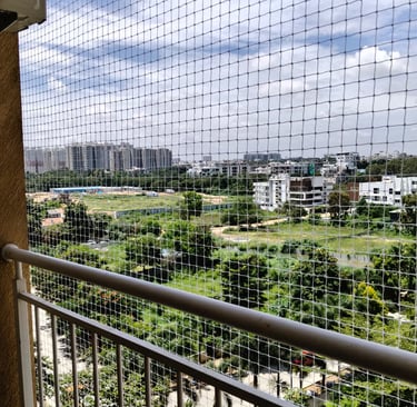 Completed pigeon net installation on a rooftop, blending seamlessly with the building structure.