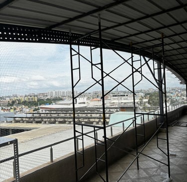 Sukumari Safety Nets team at work installing pigeon safety nets on a residential balcony