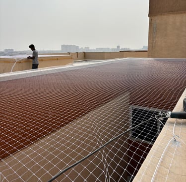 Close-up of a securely installed children safety net on a balcony in Basavanagudi, showing sturdy kn