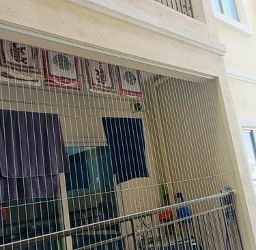 View from inside a Bengaluru apartment showing clear, unobstructed balcony views through subtle gril