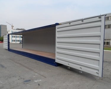 a container container with a door open and a wooden floor