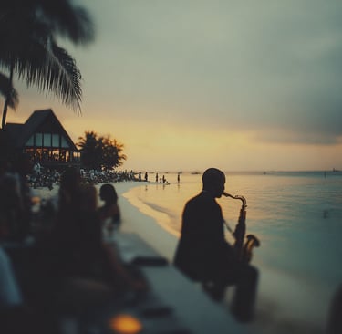 A silhouetted musician plays the saxophone on a tropical beach at sunset during a seaside party.