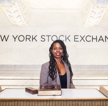 Dorian Price ringing the bell at NYSE for the 50th anniversary of women federal service academies