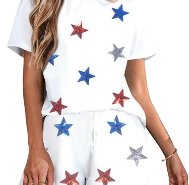 Women wearing white two-piece lounge set with red, blue, and silver sequin stars.