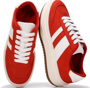 Red suede sneakers with white stripes and platform soles for women.