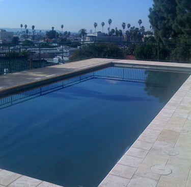 a pool with a view of a city skyline