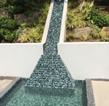 tiled pyramid water feature going up a mountain like a Myan temple