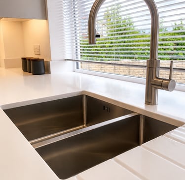 Stainless steel undermount kitchen sink with a modern swan-neck boiling water tap, fitted in Iffley