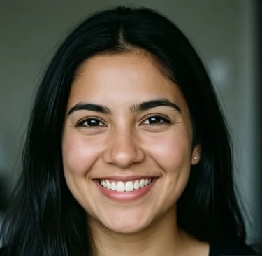 Close-up portrait of a smiling woman with long black hair and a natural look.