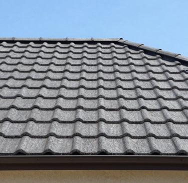 A glass of red wine next to a bottle