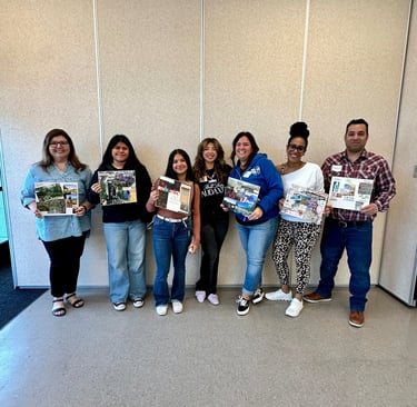 a group of people holding up pictures of themselves
