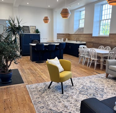Finished living and dining area with modern furniture and restored architectural details.