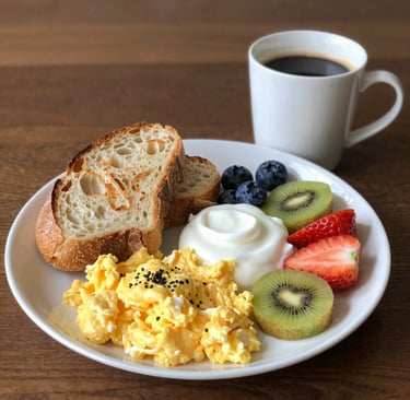 Close-up of a vibrant breakfast plate featuring fruits and whole grains.