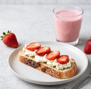 Close-up of a colorful, fresh salad with avocado and cherry tomatoes.