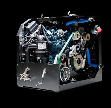 A heavy-duty industrial diesel engine unit with belts and pulleys inside a black metal casing.