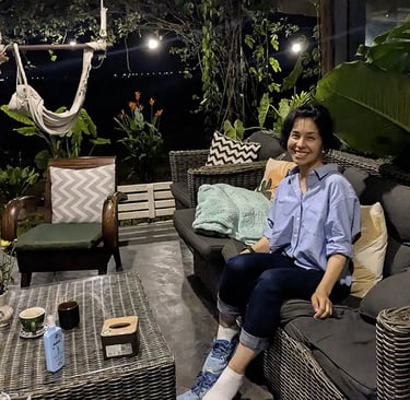 Person sitting at coworking space terrace at night in Hoi An, Vietnam