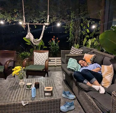 Person sleeping on couch at coworking space in Vietnam