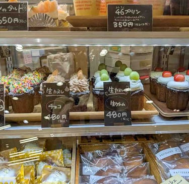 Display of Japanese pastries and decorated canelés in a bakery shop in Shizuoka, Japan.