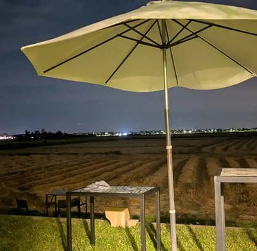 Night view from coworking space overlooking rice fields in Hoi An, Vietnam