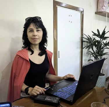 A woman working on a laptop while reflecting on her seven-week stay in Vietnam