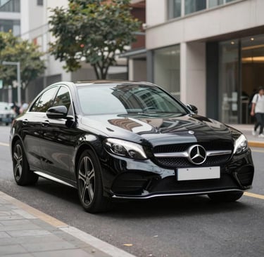 Close-up of a sleek imported vehicle with a personalized license plate.
