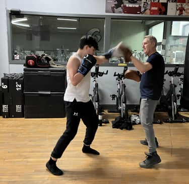 joe mccutcheon boxer instructor with teen working out
