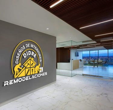 Modern office lobby with the Diseños de Interiores DIDRE Remodelaciones logo on a gray wall.