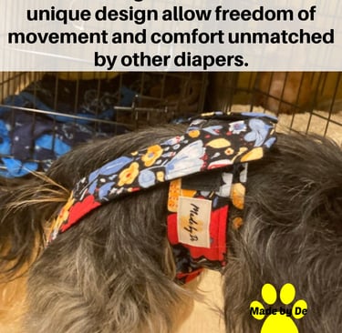A small dog wearing floral pattern Great Fit dog britches, comfortable pet diapers by Made by De.