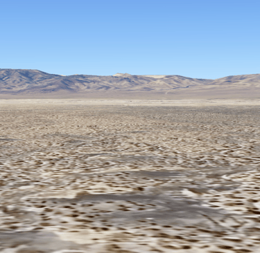 a desert scene with a lone horse in the foreground