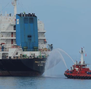 a tug boat with a tuggle in the water
