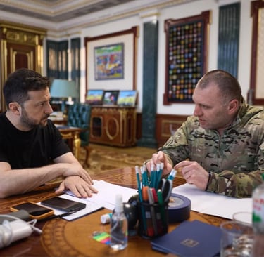 a soldier in uniform sitting at a table