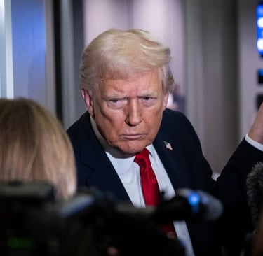 a man in a suit and tie with a camera