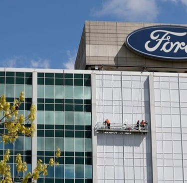 a man on a platform on a platform with a sign that says ford