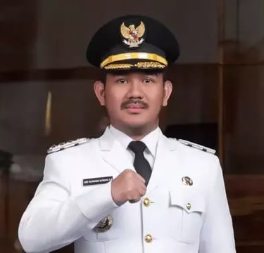 a man in a uniform is posing for a picture