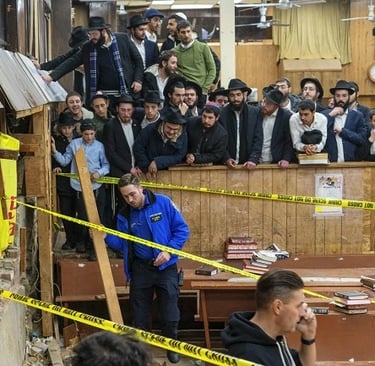 a man in a suit and tie is standing in front of a group of people