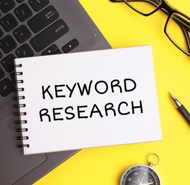 A note pad that has keyword research lines written on it.