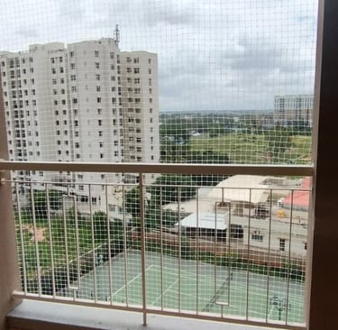 Close-up of a freshly installed balcony safety net in T Nagar, showing the sturdy mesh and secure fi