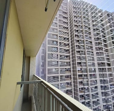 Installation process of pigeon nets on a window in a Bangalore apartment.