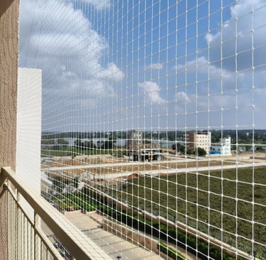 View from inside a balcony showing the neat, unobtrusive safety netting
