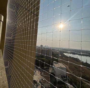 Close-up of a sturdy balcony safety net installed on a high-rise apartment in T Nagar.