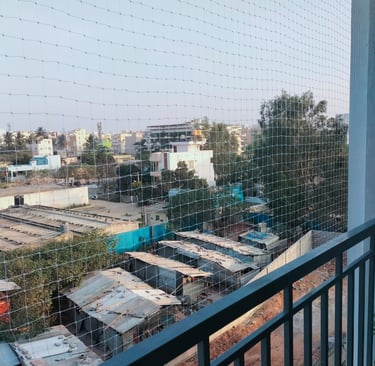 Wide view showing a secure duct area covered with safety nets at an apartment complex