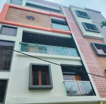 Evening shot of a balcony with safety netting, showing how it blends seamlessly with the building’s