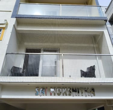 Close-up of a sleek invisible grill seamlessly blending with a Royapettah balcony.