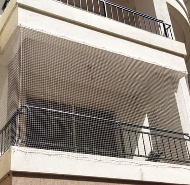 Installation process of invisible grills by Arjilli Enterprises team at an Alwarpet residence.